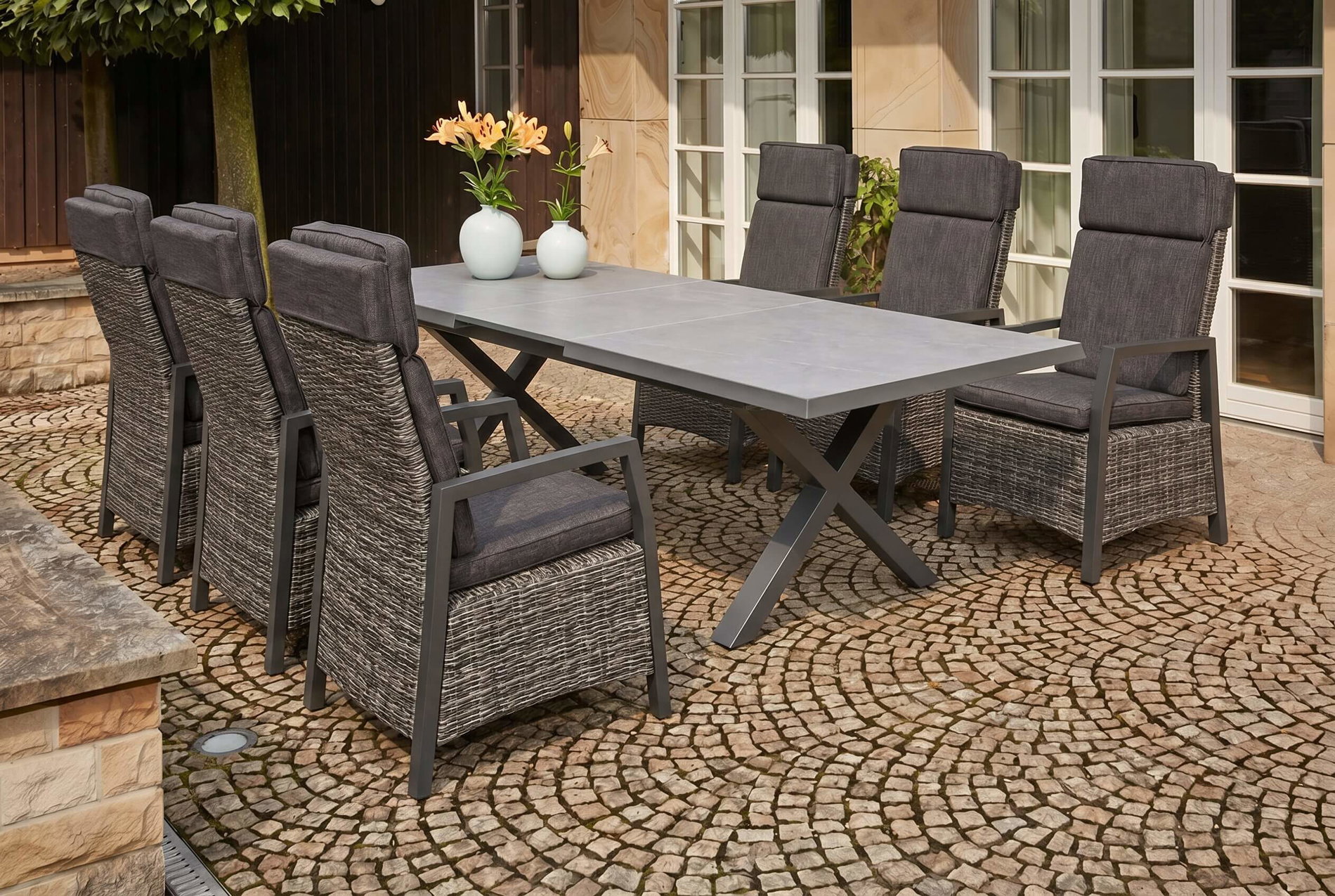 OUTFLEXX Serro Conjunto de comedor de jardín, negro/antracita/gris, aluminio/polirratán/imitación de piedra, mesa 200/260 x 100 cm, 6 sillones de comedor